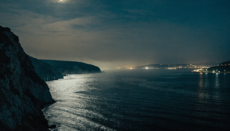 Strait of Hormuz coastline at night amid US strikes on Iran